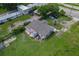 Aerial view of a home showing the roof, surrounding landscape, and adjacent street at 407 Snively Ave, Winter Haven, FL 33880