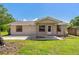 Charming single story home with a well-kept lawn and a cozy front porch, perfect for relaxing at 407 Snively Ave, Winter Haven, FL 33880