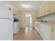 Functional kitchen with white appliances and ample cabinet space, ready for your personal touch at 407 Snively Ave, Winter Haven, FL 33880