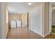 Well-lit laundry room with washer, dryer, tile floors and closet storage at 407 Snively Ave, Winter Haven, FL 33880