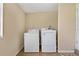 A spacious laundry area with modern washer and dryer units for convenient laundry days at 407 Snively Ave, Winter Haven, FL 33880