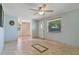 The living room is filled with natural light and classic tile flooring, adjacent to another room at 407 Snively Ave, Winter Haven, FL 33880