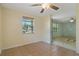 Inviting living room with tile flooring, a ceiling fan, and natural light from the window at 407 Snively Ave, Winter Haven, FL 33880