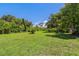 Picture of a large lot that is covered in healthy green grass and mature trees at 407 Snively Ave, Winter Haven, FL 33880