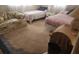 Bedroom featuring two twin beds, floral couch, and side table at 4160 Poinciana Dr, Indian Lake Estates, FL 33855