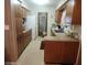 Cozy kitchen featuring wood cabinets and laminate countertops at 4160 Poinciana Dr, Indian Lake Estates, FL 33855