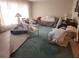 Comfortable living room with carpet, furniture, and natural light at 4160 Poinciana Dr, Indian Lake Estates, FL 33855