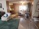 Inviting living room with casual seating area and adjacent dining space at 4160 Poinciana Dr, Indian Lake Estates, FL 33855