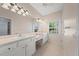Bright bathroom with double sinks and vanity, offering both functionality and style at 4254 Berwick Dr, Lake Wales, FL 33859