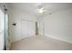 Bright bedroom with plush carpet, a ceiling fan, and closet at 4254 Berwick Dr, Lake Wales, FL 33859