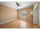 Cozy room features hardwood floors, a ceiling fan, and a well-lit lamp at 4254 Berwick Dr, Lake Wales, FL 33859