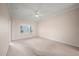 Neutral bedroom with a window and a ceiling fan, offering a calming atmosphere at 4254 Berwick Dr, Lake Wales, FL 33859