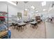 Bright community craft room featuring tables, chairs, storage shelves, and natural light at 4254 Berwick Dr, Lake Wales, FL 33859