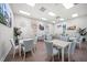 Bright dining area with tables, chairs, contemporary decor, and stylish artwork at 4254 Berwick Dr, Lake Wales, FL 33859
