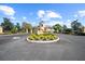 Welcoming entrance to the Lake Ashton community with manicured landscaping and gatehouse at 4254 Berwick Dr, Lake Wales, FL 33859