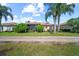 Charming single-story home with a manicured lawn, mature landscaping, and a screened-in lanai at 4254 Berwick Dr, Lake Wales, FL 33859