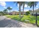 Inviting home showcasing a lush lawn, mature trees, and well-maintained landscaping at 4254 Berwick Dr, Lake Wales, FL 33859