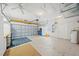 Spacious garage with ample storage cabinets, workbench, and overhead door at 4254 Berwick Dr, Lake Wales, FL 33859