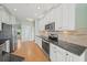 Kitchen featuring white cabinets, granite countertops and stainless steel appliances at 4254 Berwick Dr, Lake Wales, FL 33859