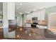 Kitchen with granite countertops, stainless steel appliances and hardwood flooring at 4254 Berwick Dr, Lake Wales, FL 33859