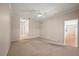 Open-concept living area with ceiling fan and access to the kitchen for easy entertaining at 4254 Berwick Dr, Lake Wales, FL 33859