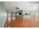 Open floor plan with hardwood floors connecting the living area and kitchen, perfect for gatherings at 4254 Berwick Dr, Lake Wales, FL 33859