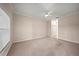 Spacious living room with a ceiling fan and neutral paint, providing a comfortable atmosphere at 4254 Berwick Dr, Lake Wales, FL 33859