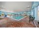 Indoor community pool, with lane markers and ample deck space, and chairs to relax by the pool at 4254 Berwick Dr, Lake Wales, FL 33859