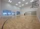 This is a beautiful indoor basketball court with tall ceilings, glass windows, and plenty of room at 4469 Turnberry Ln, Lake Wales, FL 33859