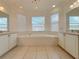 Bright bathroom with a large soaking tub, dual vanities, and plenty of natural light from bay windows at 4469 Turnberry Ln, Lake Wales, FL 33859
