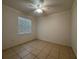 Bedroom with tile flooring, ceiling fan, and natural light at 4469 Turnberry Ln, Lake Wales, FL 33859