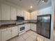 Updated kitchen featuring stainless steel appliances and granite countertops at 4469 Turnberry Ln, Lake Wales, FL 33859