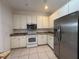 Efficient kitchen featuring granite counters, stainless appliances, and ample cabinets at 4469 Turnberry Ln, Lake Wales, FL 33859