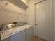 Laundry room with washer, dryer, and wire shelving at 4469 Turnberry Ln, Lake Wales, FL 33859