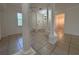 Inviting open-concept area with decorative columns and tiled flooring at 4469 Turnberry Ln, Lake Wales, FL 33859