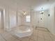 Inviting open-concept area with decorative columns and tiled flooring at 4469 Turnberry Ln, Lake Wales, FL 33859
