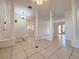 Open living area featuring tile floors, decorative columns, and plenty of natural light at 4469 Turnberry Ln, Lake Wales, FL 33859