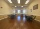 The meeting room features seating for groups of people, tables, and natural light at 4469 Turnberry Ln, Lake Wales, FL 33859