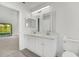 Updated bathroom features double sink vanity, modern fixtures, and neutral color palette at 529 Terranova Cir, Winter Haven, FL 33884