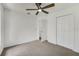 Inviting bedroom with ceiling fan and closet space creates a relaxing, functional retreat at 529 Terranova Cir, Winter Haven, FL 33884