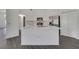 Spacious kitchen featuring quartz countertops, stainless steel appliances and island with seating at 529 Terranova Cir, Winter Haven, FL 33884