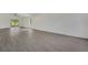 Spacious living room with modern flooring, large windows for natural light, and ceiling fan at 529 Terranova Cir, Winter Haven, FL 33884