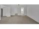 Bright, open living room features neutral carpet, and easy access to other areas of the home at 529 Terranova Cir, Winter Haven, FL 33884