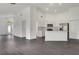 Open concept living space, seamlessly connecting the living room and kitchen with recessed lighting at 529 Terranova Cir, Winter Haven, FL 33884