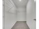 Spacious walk-in closet with ample shelving for optimal organization and storage solutions at 529 Terranova Cir, Winter Haven, FL 33884