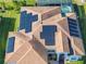 Aerial view of a single Gathering home showcasing a brown roof with solar panels at 5340 Nicklaus Dr, Winter Haven, FL 33884