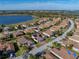 Aerial view of a residential community showing a single-Gathering home with solar panels at 5340 Nicklaus Dr, Winter Haven, FL 33884