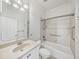 Bathroom featuring tiled shower/tub, vanity with lighting, and accessibility features at 5340 Nicklaus Dr, Winter Haven, FL 33884
