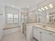 Bright bathroom with a large shower and a cozy window bench seat at 5340 Nicklaus Dr, Winter Haven, FL 33884