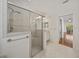 Bathroom featuring a large shower with a built-in seat and access to bedroom at 5340 Nicklaus Dr, Winter Haven, FL 33884